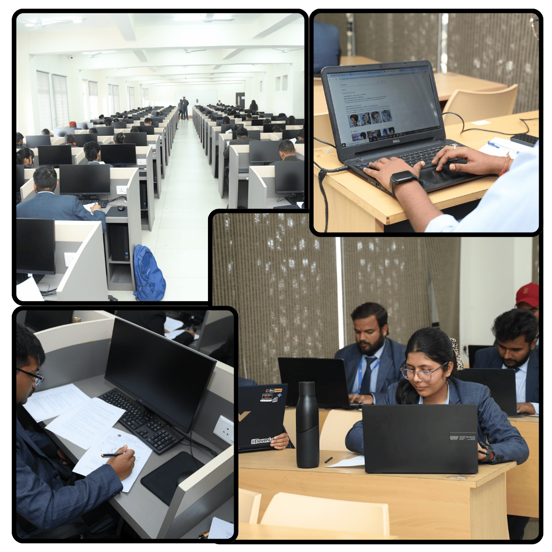 Students working on laptops in university computer lab during placement preparation training